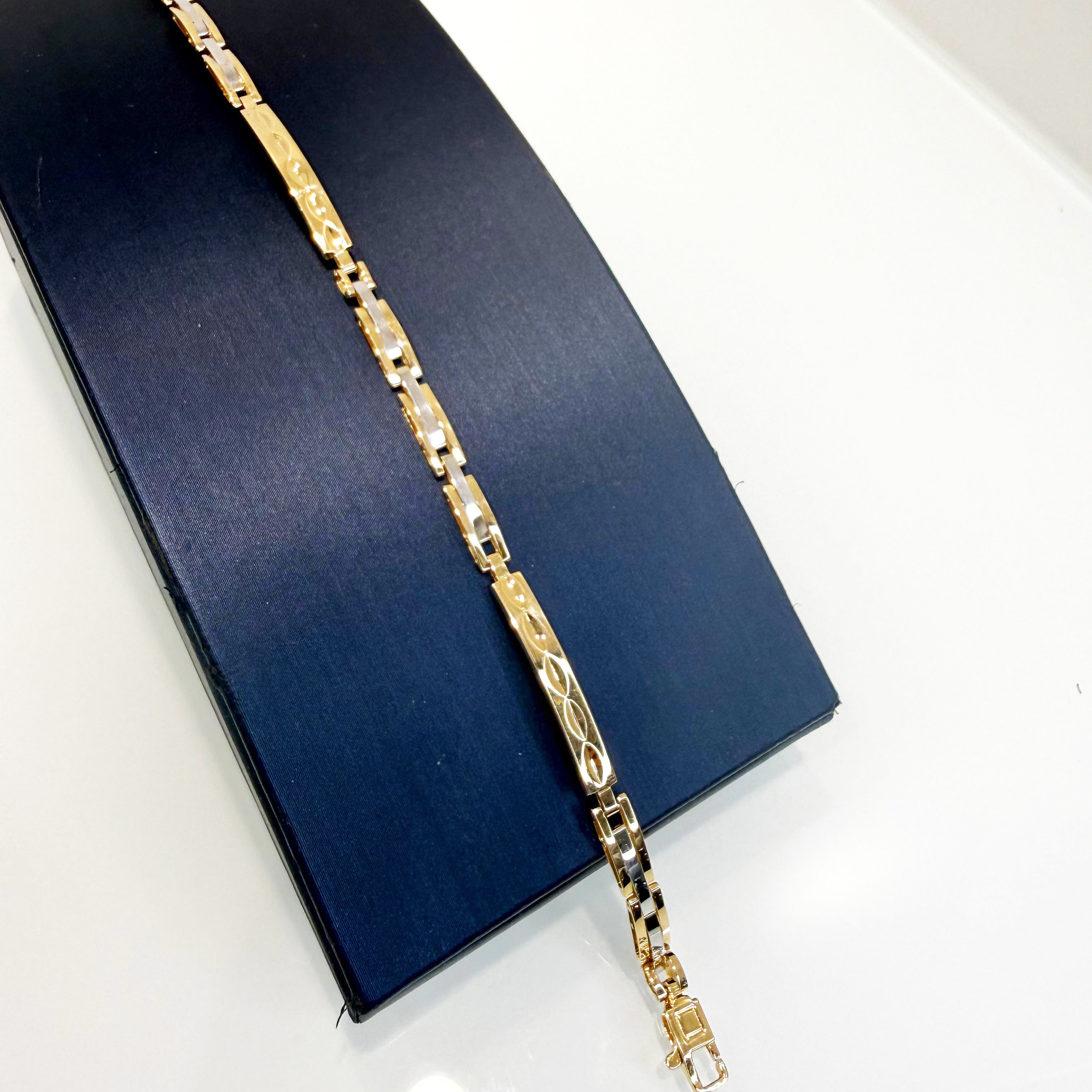 Bracciale uomo bicolore in oro giallo e oro bianco 18KT (750) con maglie lavorate – Made in Italy