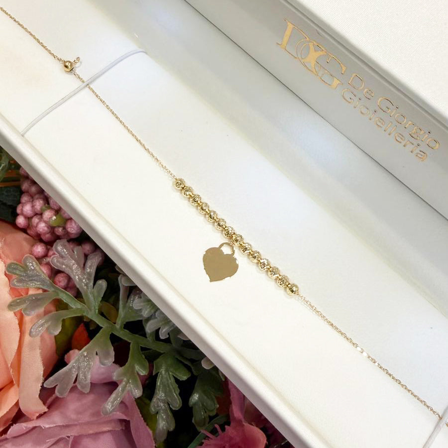 Bracciale con sfere diamantate e cuore in oro giallo 18 KT (750)