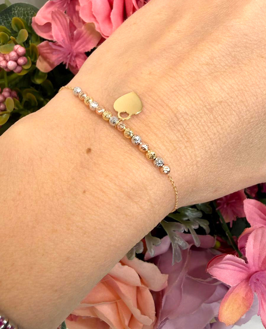 Bracciale con sfere diamantate tricolore e cuore in oro giallo 18 KT (750)