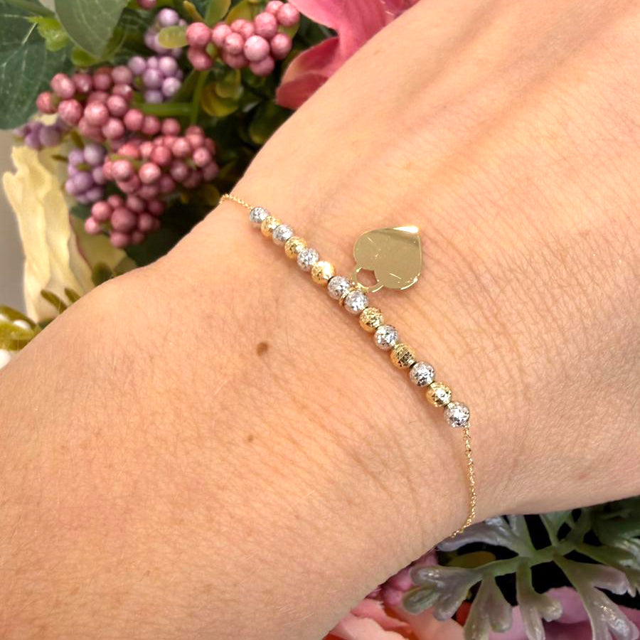 Bracciale con sfere diamantate bicolore e cuore in oro giallo 18 KT (750)