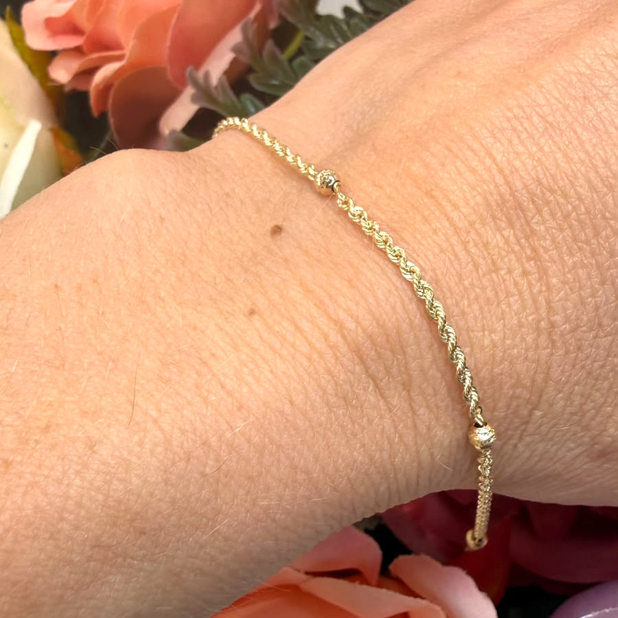 Bracciale con sfere diamantate in oro giallo 18 KT (750)