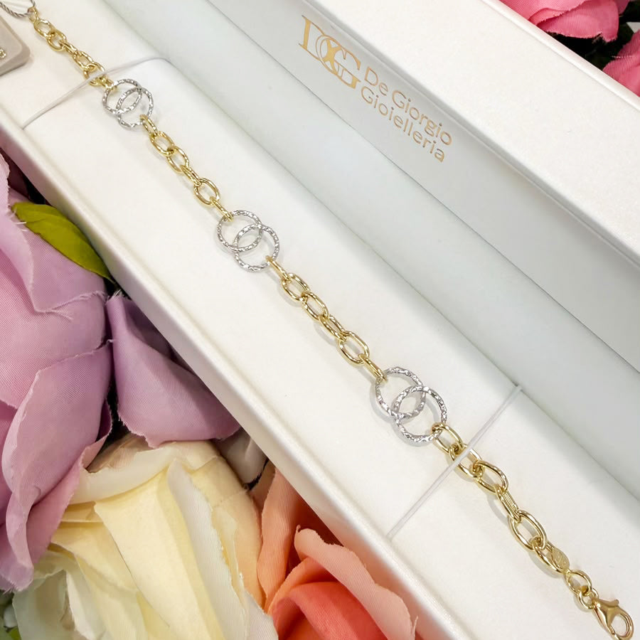 BRACCIALE IN ORO GIALLO E BIANCO 18 KT (750) CON CERCHI INTRECCIATI