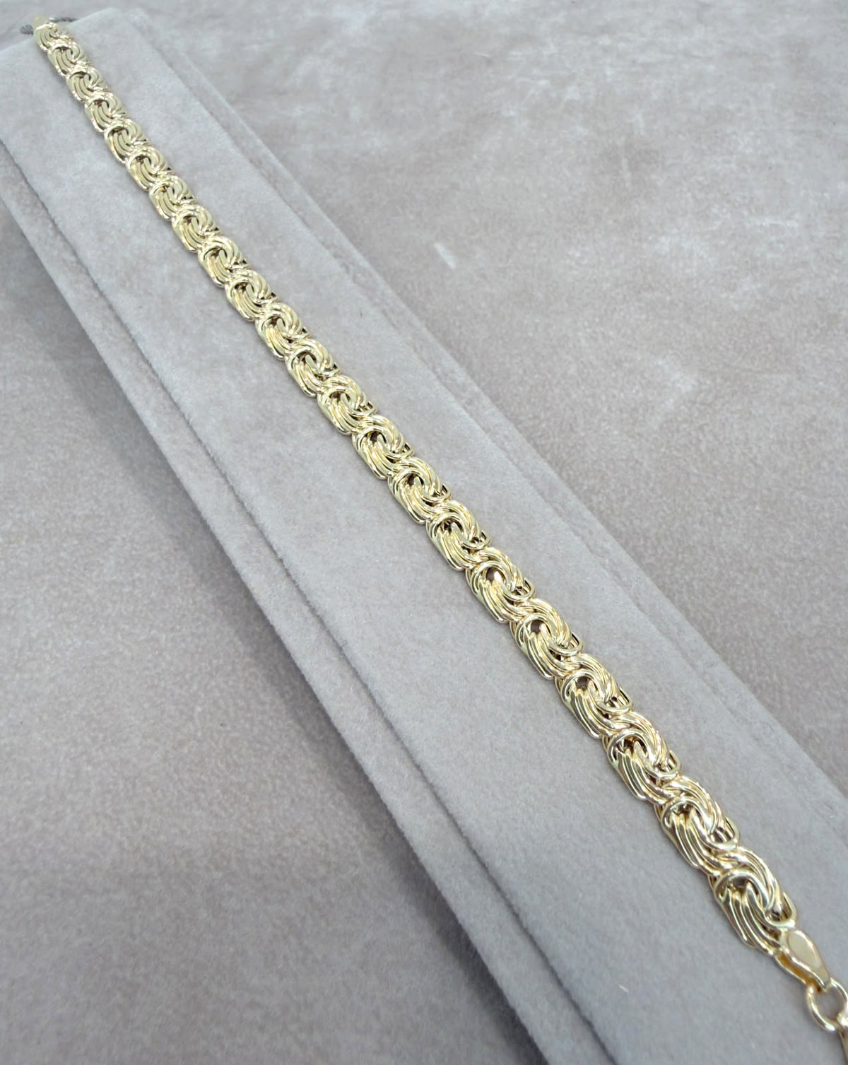 BRACCIALE A MAGLIA INTRECCIATA IN ORO GIALLO 18 KT (750)