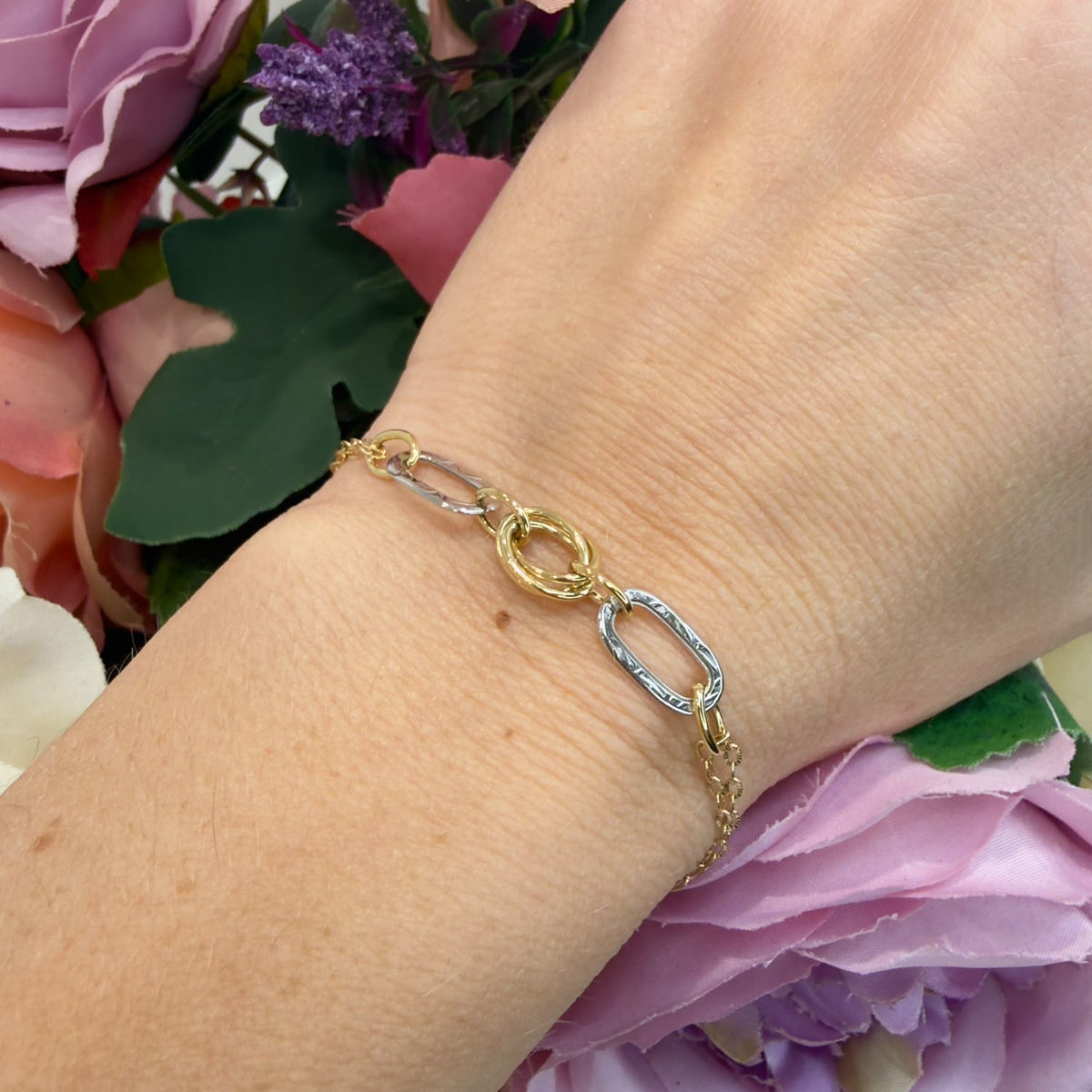 BRACCIALE IN ORO GIALLO E BIANCO 18 KT (750) CON ELEMENTI OVALI