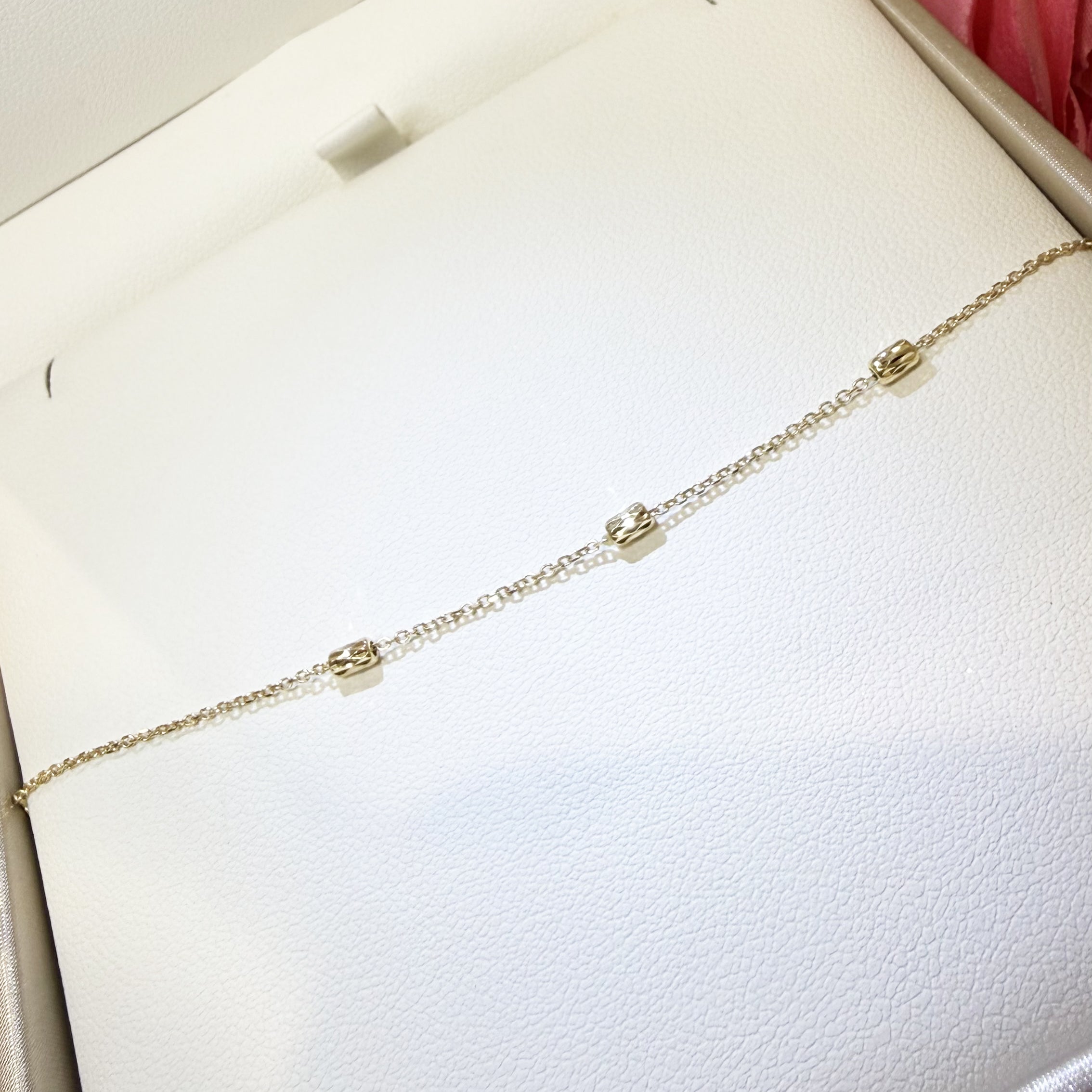 BRACCIALE BABY CON CILINDRETTI SFACCETTATI IN ORO GIALLO 18KT (750)