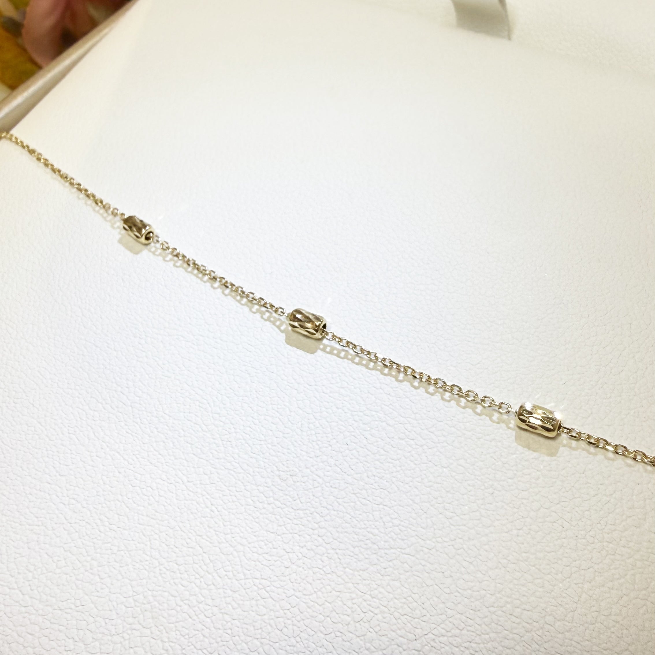 BRACCIALE BABY CON CILINDRETTI SFACCETTATI IN ORO GIALLO 18KT (750)