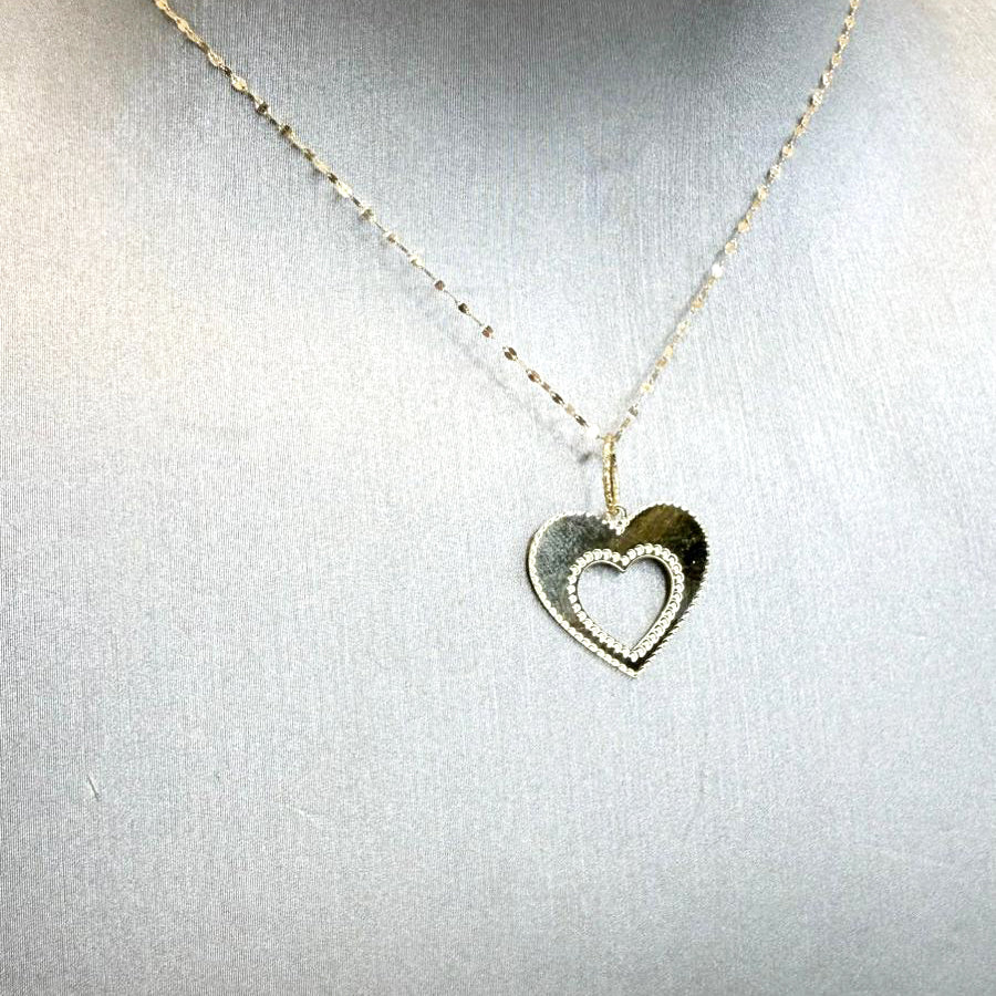 Collana con cuore traforato e bordo lavorato in oro giallo 18 KT (750)