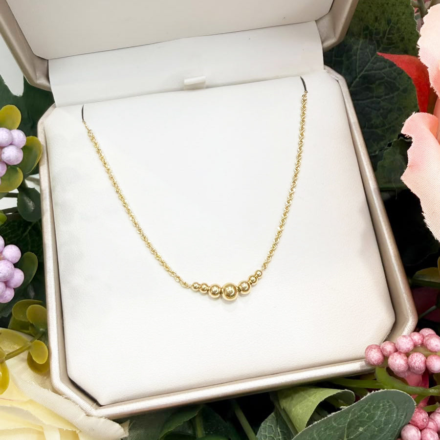 Collana con sfere centrali in oro giallo 18 KT (750)