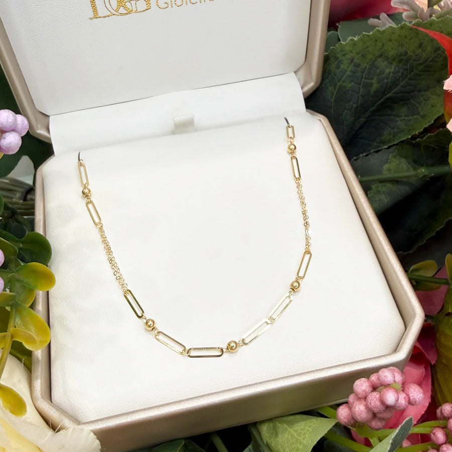 Collana con maglie geometriche e sfere in oro giallo 18 KT (750)