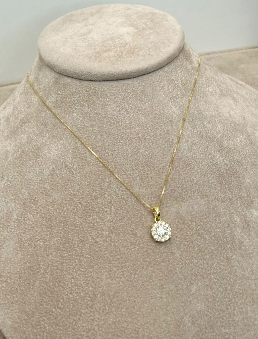 COLLANA CON PENDENTE PUNTO LUCE TONDO CON ZIRCONI IN ORO GIALLO 18 KT