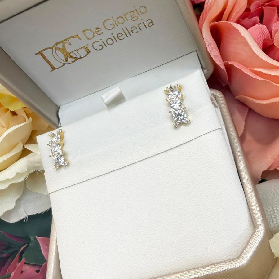 Orecchini trilogy con zirconi in oro giallo 18 KT (750)