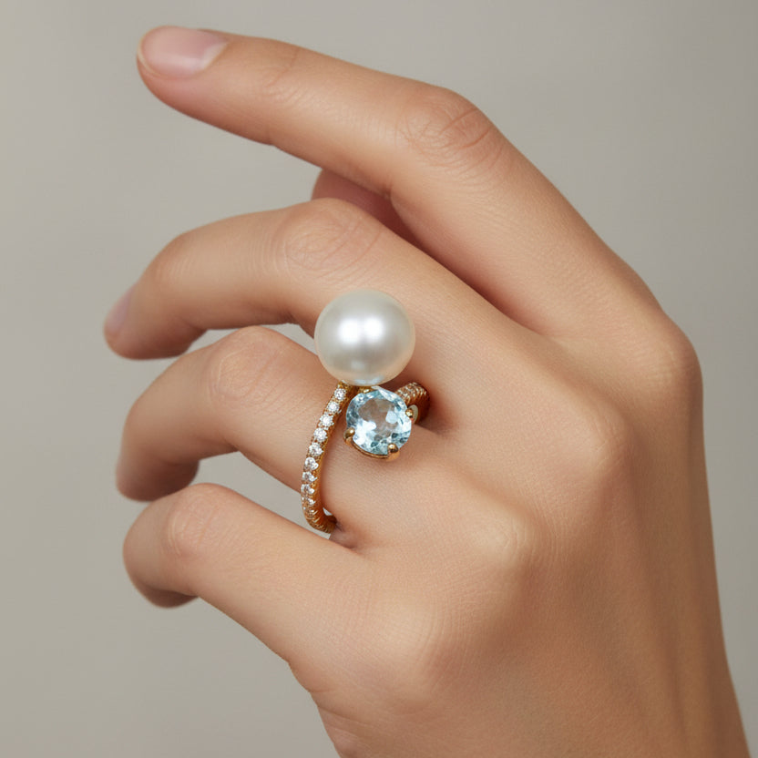 Anello contrarié con perla e topazio azzurro in oro giallo 18KT (750) con zirconi – Made in Italy