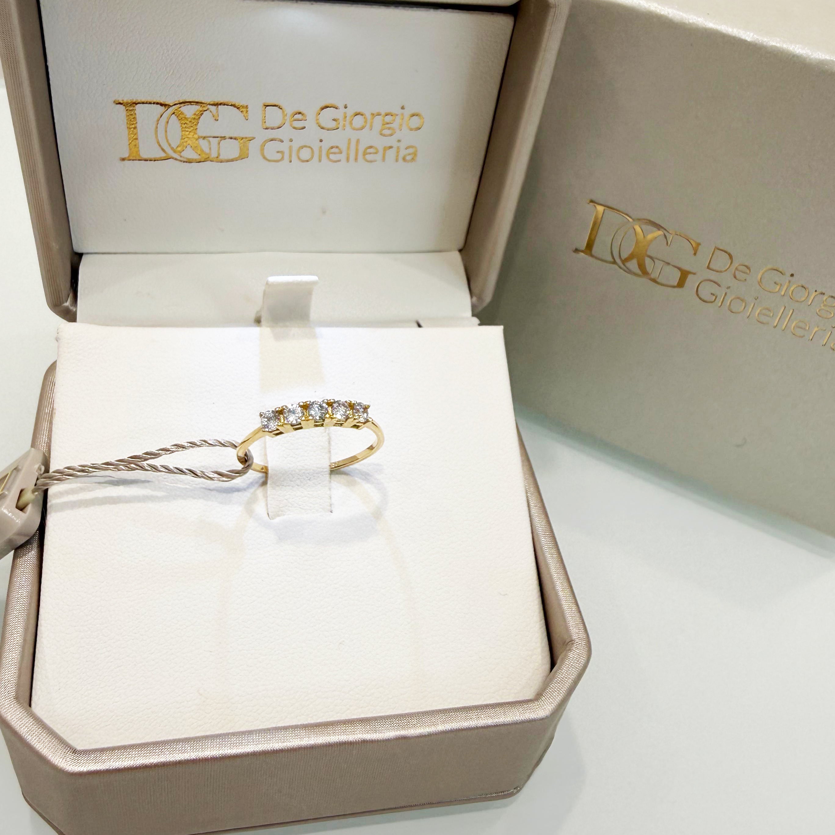 Anello riviera in oro giallo 18KT (750) con zirconi bianchi - Made in Italy