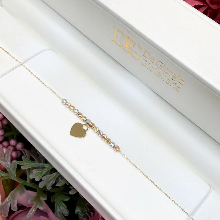 Bracciale con sfere diamantate tricolore e cuore in oro giallo 18 KT (750)
