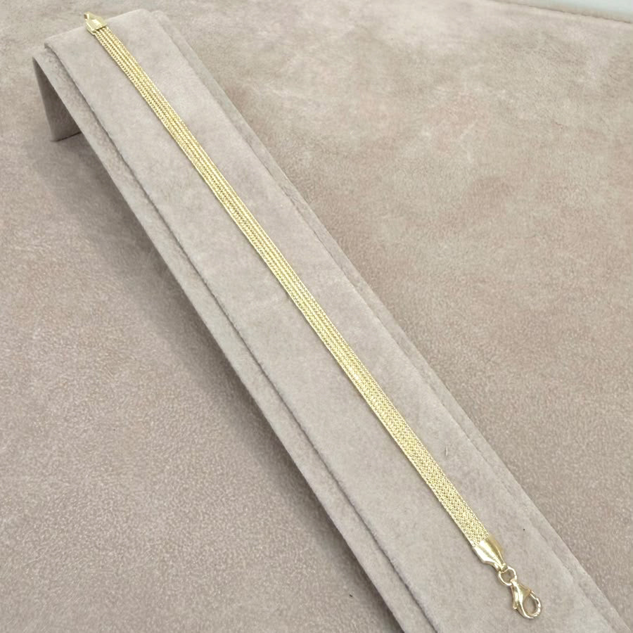 BRACCIALE A FASCIA LAVORATA IN ORO GIALLO 18 KT
