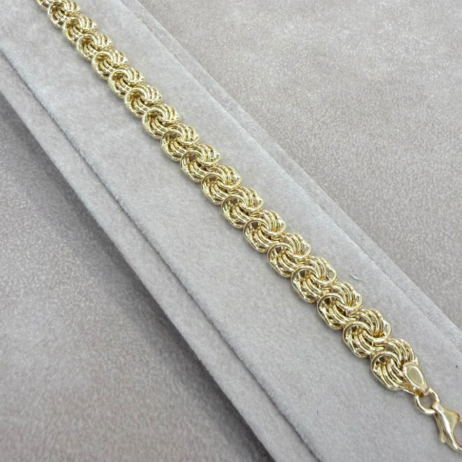 BRACCIALE A MAGLIE INTRECCIATE IN ORO GIALLO 18 KT