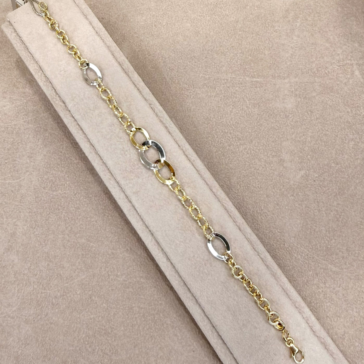 BRACCIALE IN ORO GIALLO E BIANCO 18 KT (750) CON MAGLIE OVALI