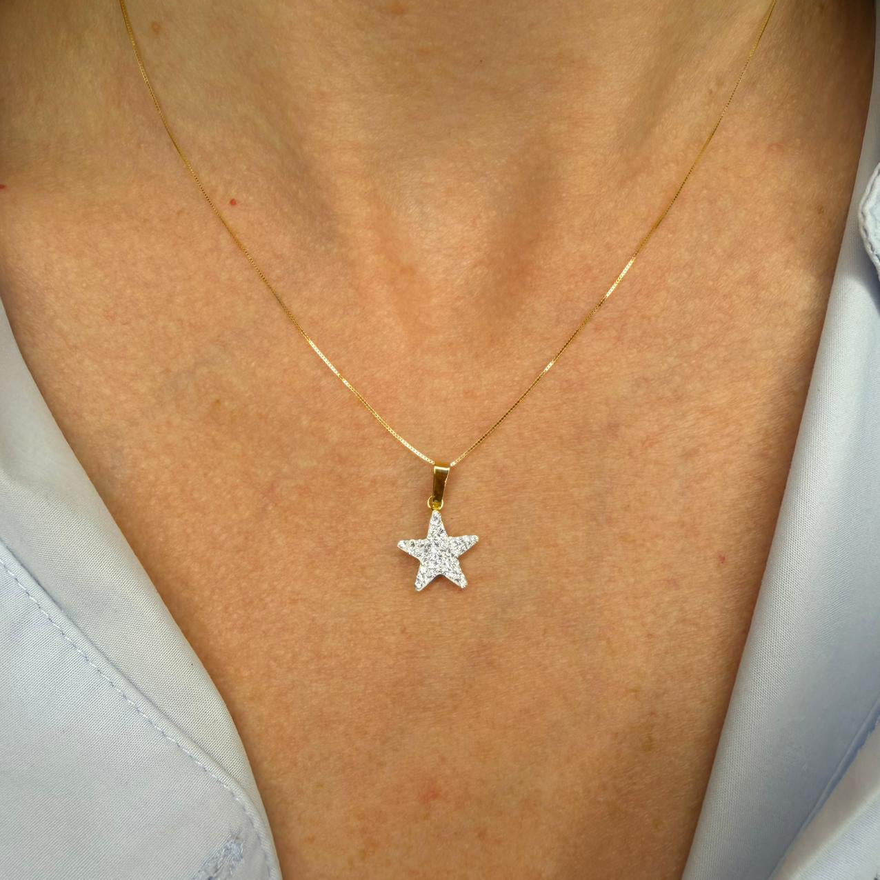 Ciondolo stella da donna con zirconi in oro giallo (750)