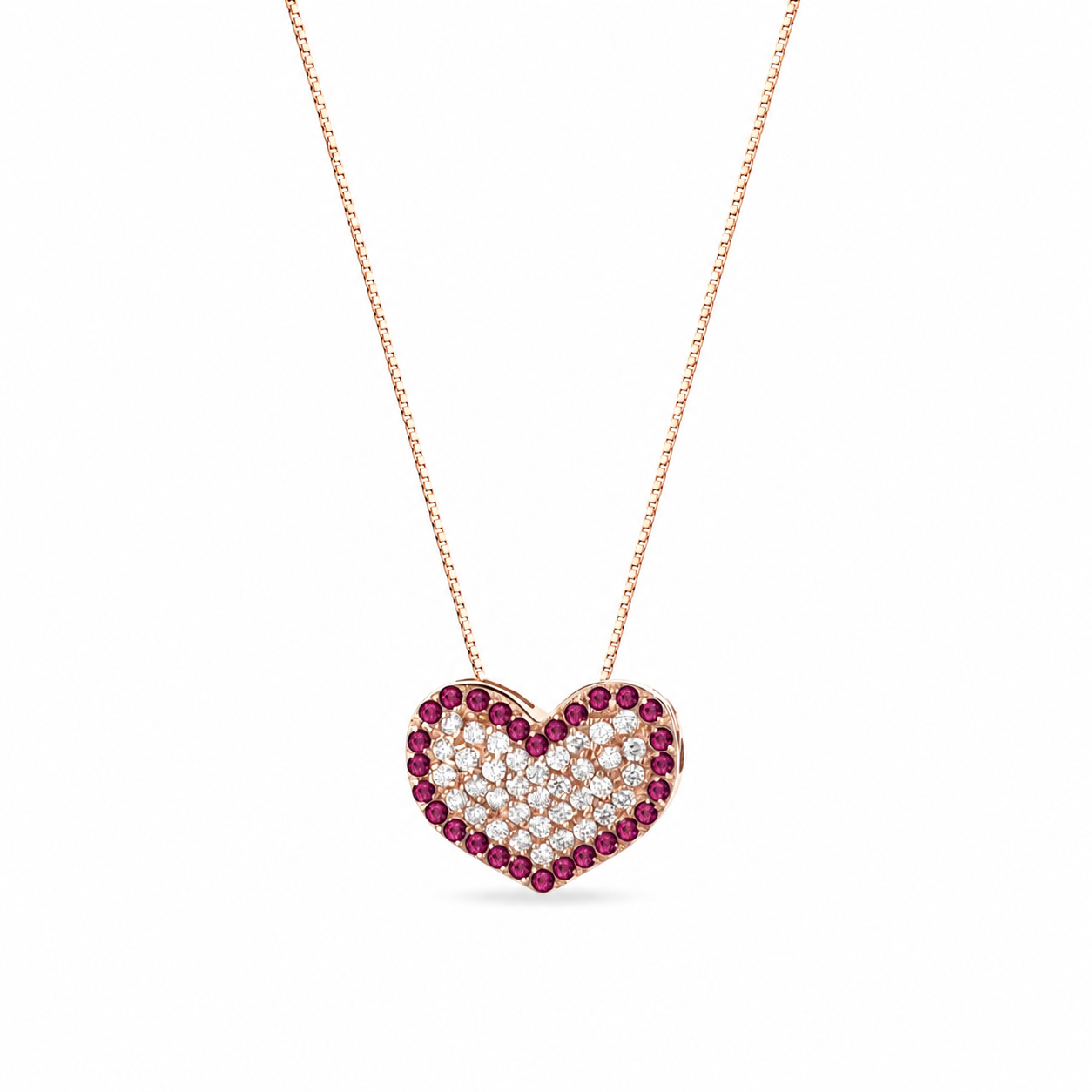 CIONDOLO CUORE IN ORO ROSA 18 CARATI E RUBINI NATURALI