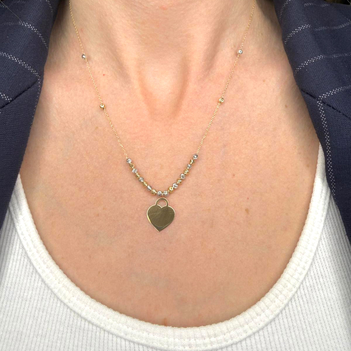 Collana con cuore incidibile in oro giallo 18KT (750) e sfere diamantate