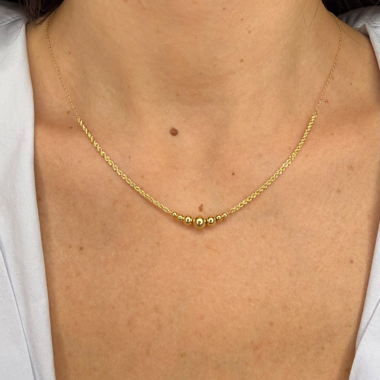 Collana con sfere centrali in oro giallo 18 KT (750)