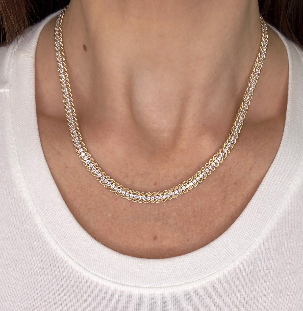 COLLANA TENNIS CON LAVORAZIONE INTRECCIATA IN ORO GIALLO 18 KT (750)