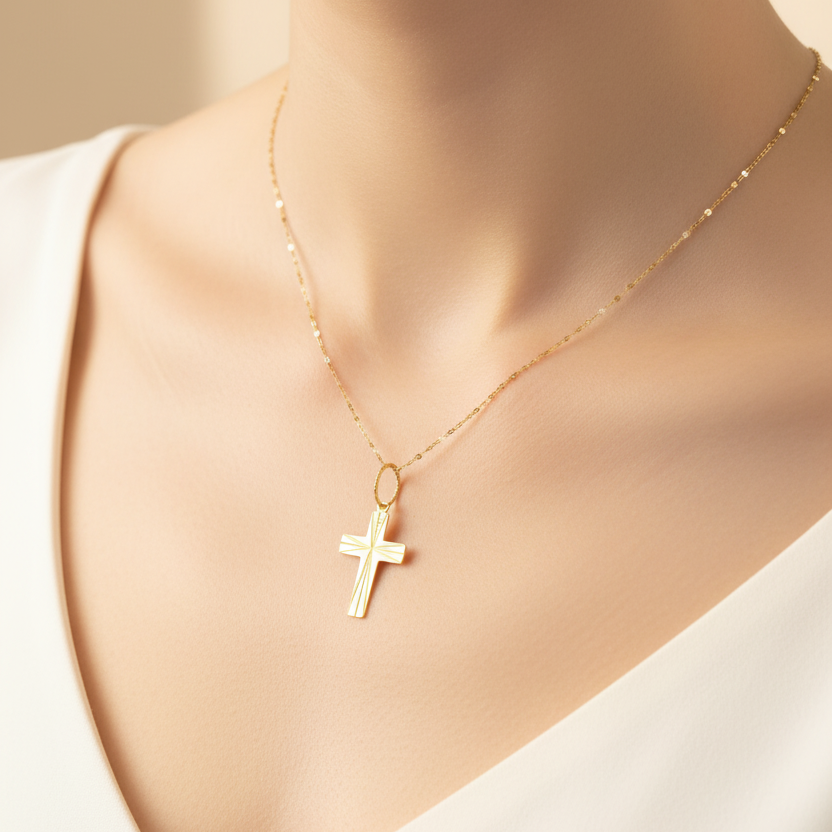 Croce con finitura sfaccettata in oro giallo 18 KT (750)