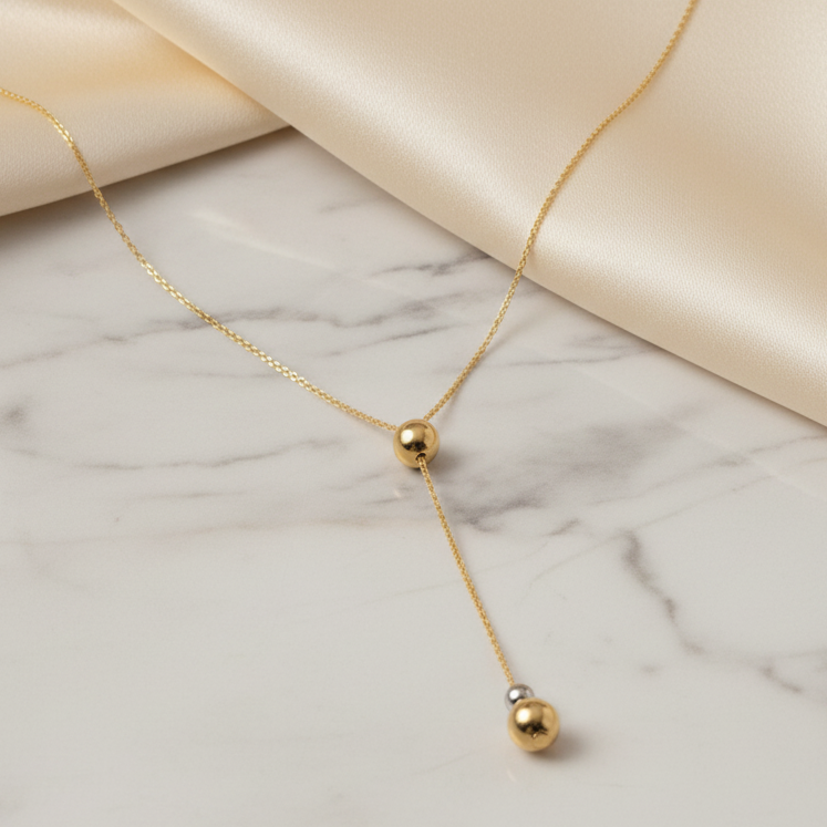 Collana lunga con sfere in oro giallo e bianco 18KT (750) – Made in Italy