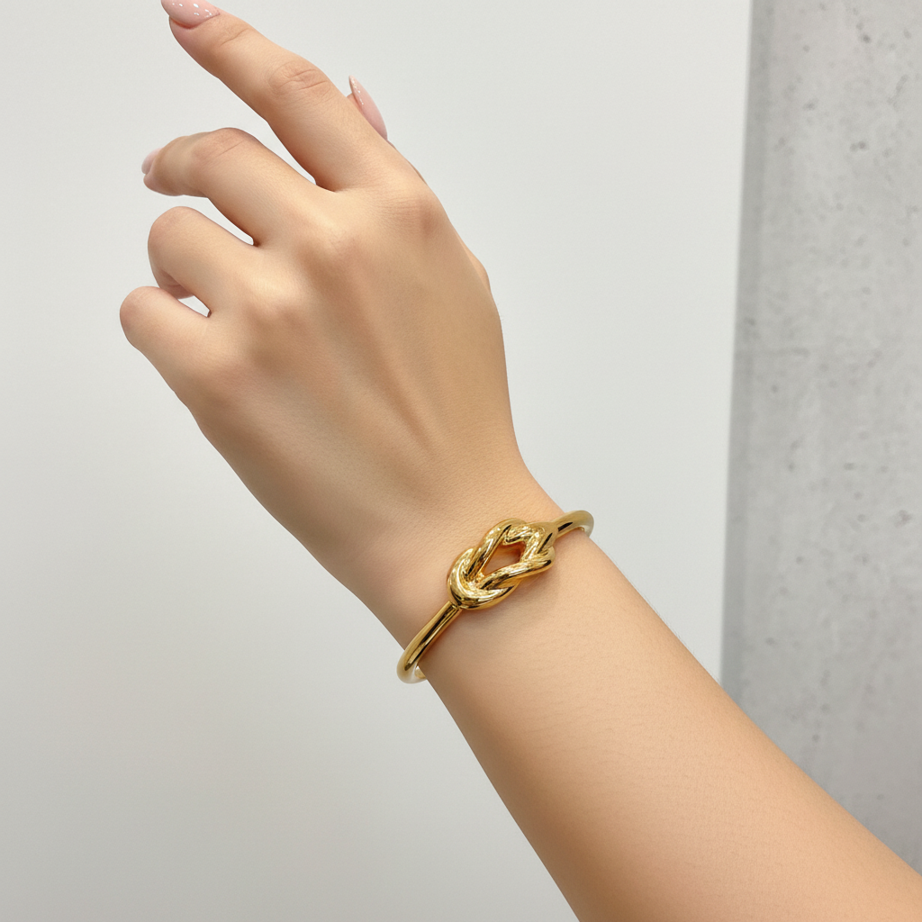 Bracciale rigido con nodo in oro giallo 18KT (750) – Made in Italy